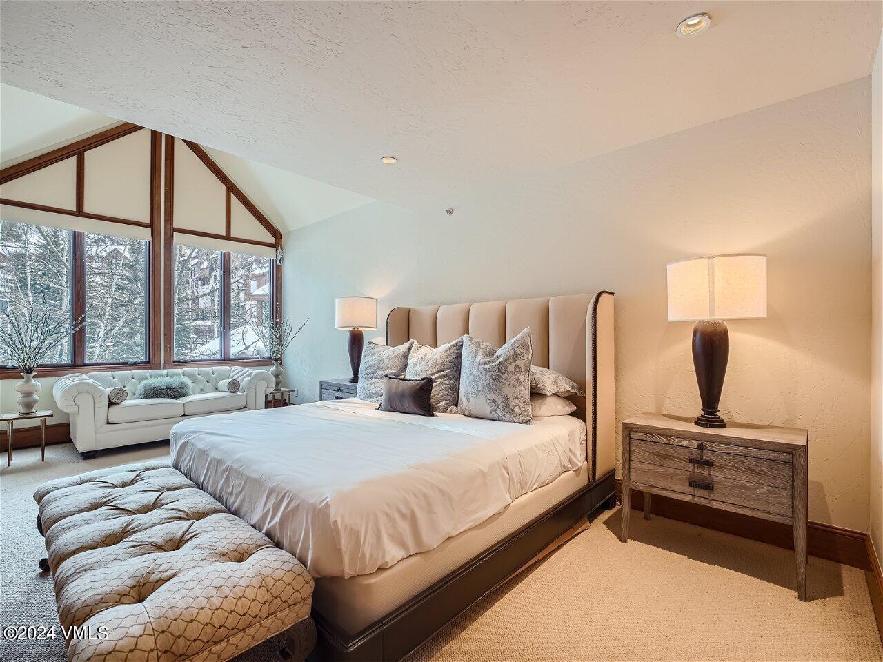 62 Highlands Lane, Unit R306 Beaver Creek, CO 81620 - Photo 10 of 32 a bedroom with two beds and a large window
