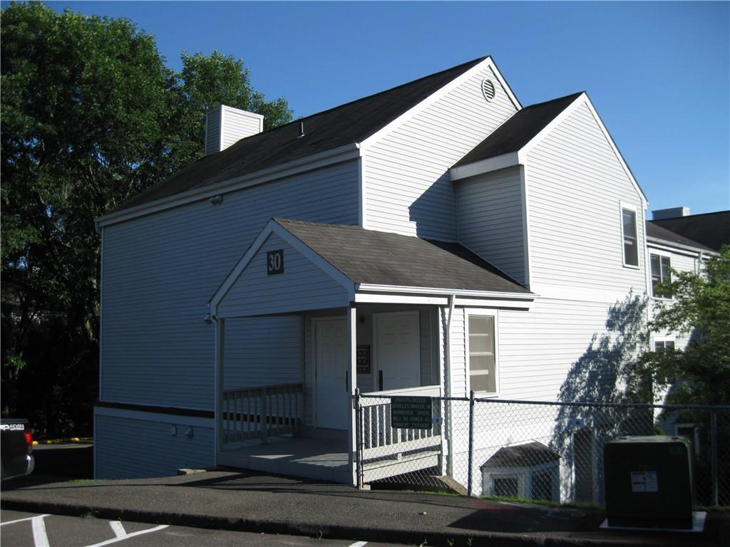 55 Mill Plain Road, Unit 3015 Danbury, CT 06811 - Photo 1 of 1 a front view of a house with garage