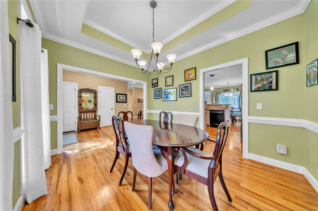 648 Mountain View Road Williamston, SC 29697 - Photo 10 of 42 Elegant crown molding and rich hardwood floors define this inviting dining area.
