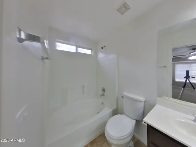a picture of a bathroom with a shower