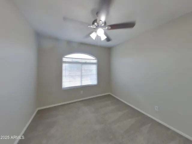 a bathroom with a sink a toilet a mirror a vanity and bathtub