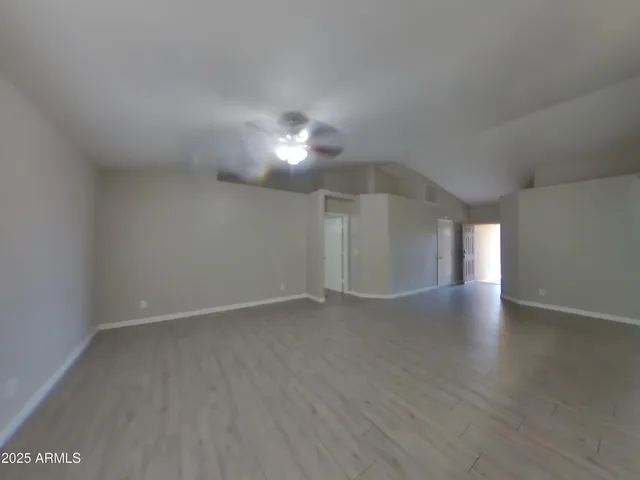 a view of empty room with windows