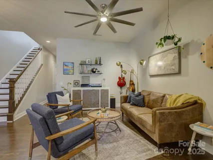 a bathroom with a granite countertop sink a toilet and a mirror