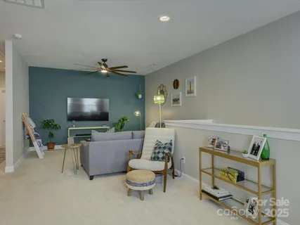 a bedroom with a bed and wall painting