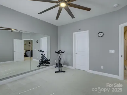 a bathroom with a granite countertop sink a large mirror and a shower