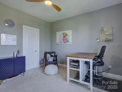 a view of a workspace with furniture