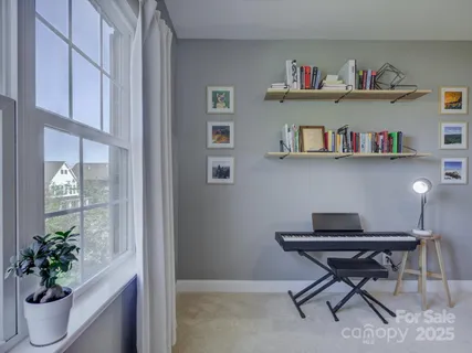 a view of room with workspace and windows