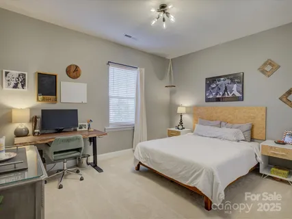 a bedroom with a workspace