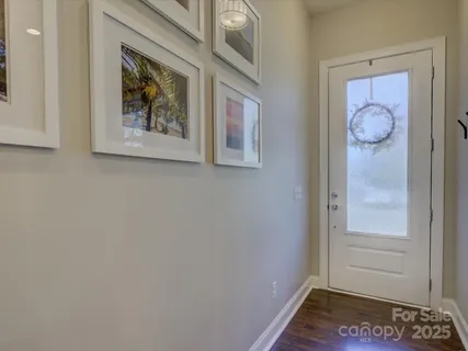 a kitchen with stainless steel appliances granite countertop a stove a sink a refrigerator and a microwave