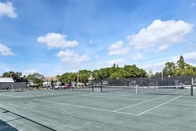 a view of a lake with couches in roof deck