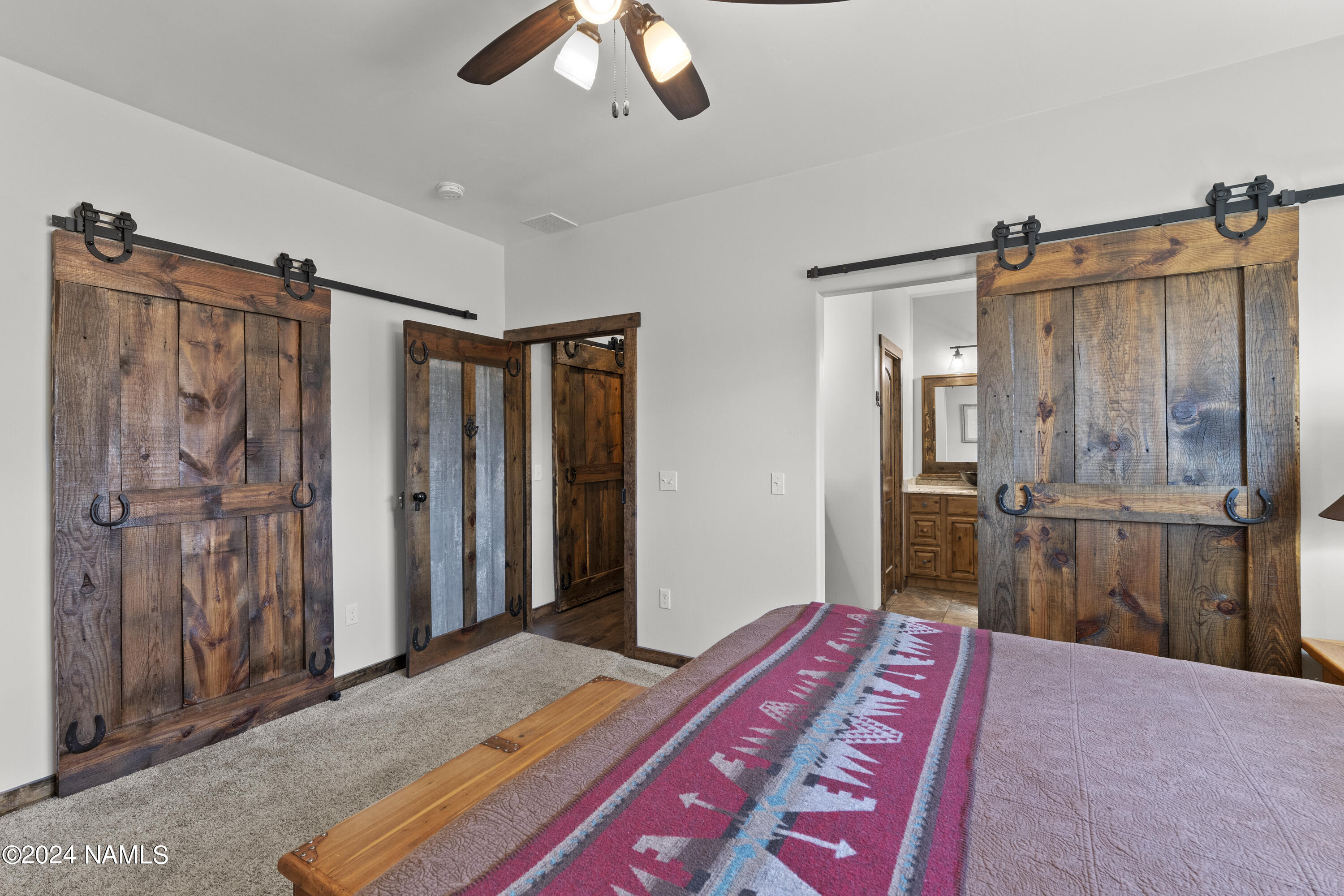 5268 Pabst Way Flagstaff, AZ 86004 - Photo 21 of 55 Barn door to Master Bathroom and Closet