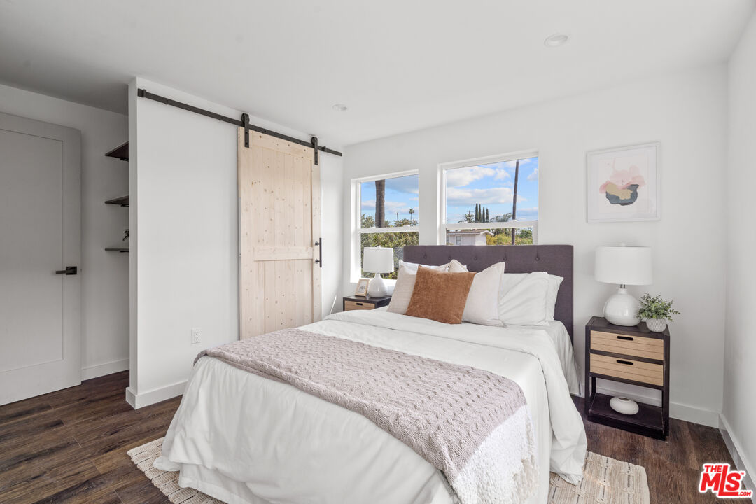 2209 West Boulevard Los Angeles, CA 90016 - Photo 17 of 29 a bedroom with a bed and a window