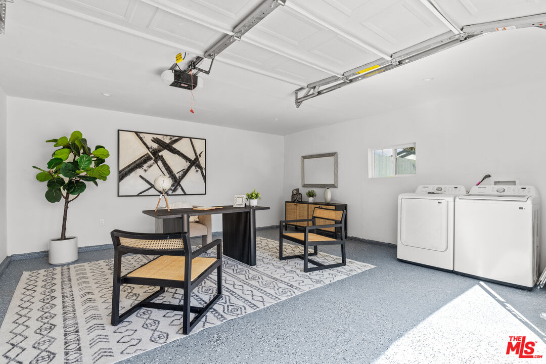 2209 West Boulevard Los Angeles, CA 90016 - Photo 20 of 29 a living room with furniture a chandelier and a window