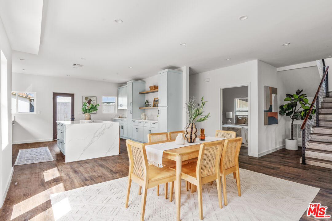 2209 West Boulevard Los Angeles, CA 90016 - Photo 2 of 29 a dining room with furniture and wooden floor