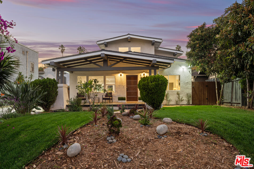 2209 West Boulevard Los Angeles, CA 90016 - Photo 25 of 29 a view of a chair and table in backyard of the house