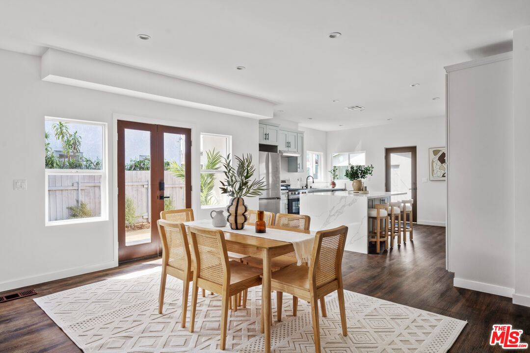 2209 West Boulevard Los Angeles, CA 90016 - Photo 5 of 29 a dining room with furniture and wooden floor
