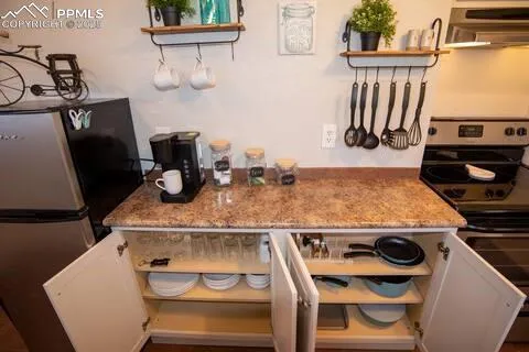 a kitchen with a stove and a microwave