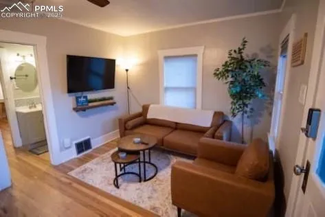 a living room with furniture and a flat screen tv
