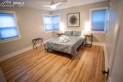 a bedroom with a bed and a table