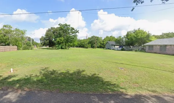 a view of a big yard next to a building