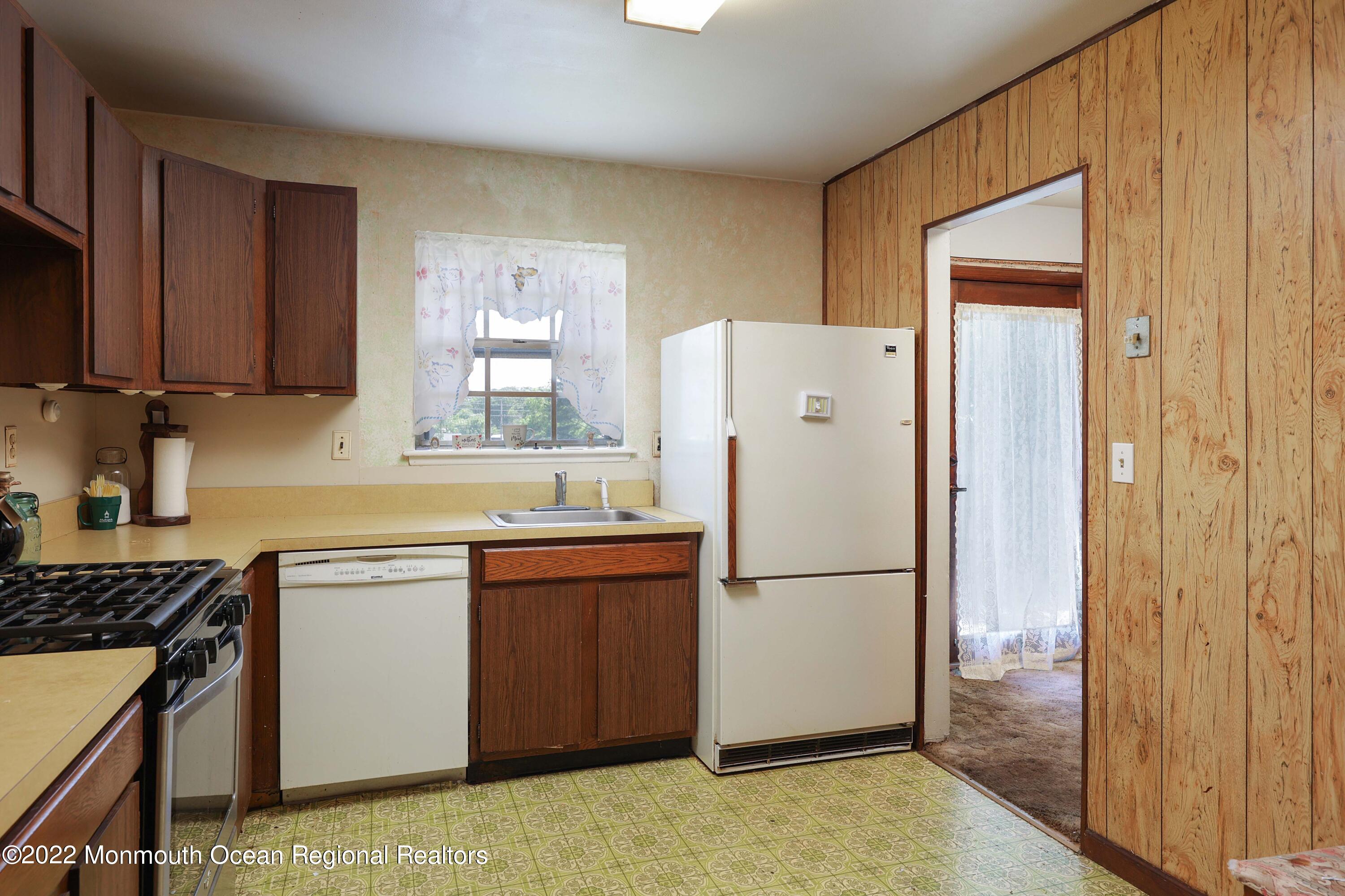 53 Valley Road Jackson, NJ 08527 - Photo 5 of 11 a kitchen with a refrigerator sink and cabinets