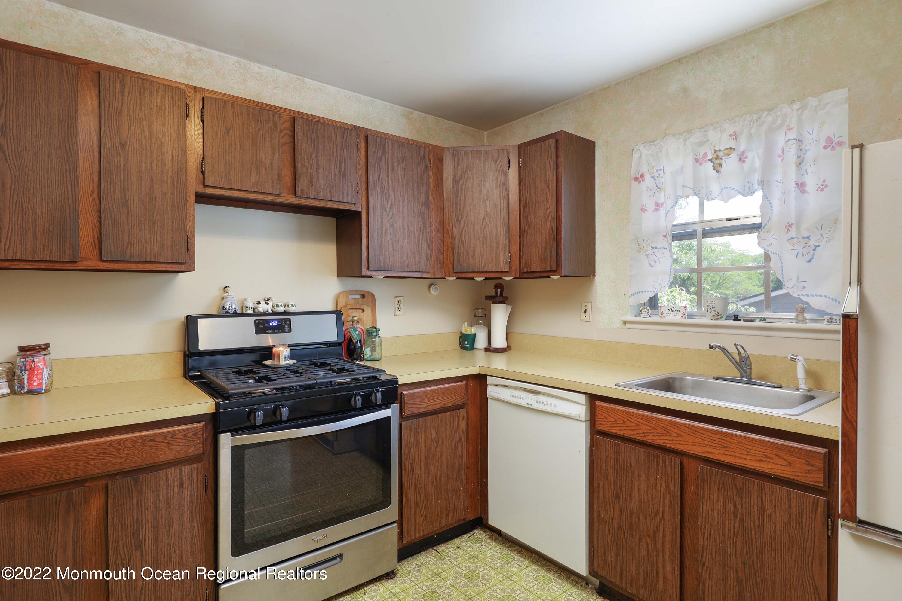 53 Valley Road Jackson, NJ 08527 - Photo 6 of 11 a kitchen with stainless steel appliances a stove sink and cabinets