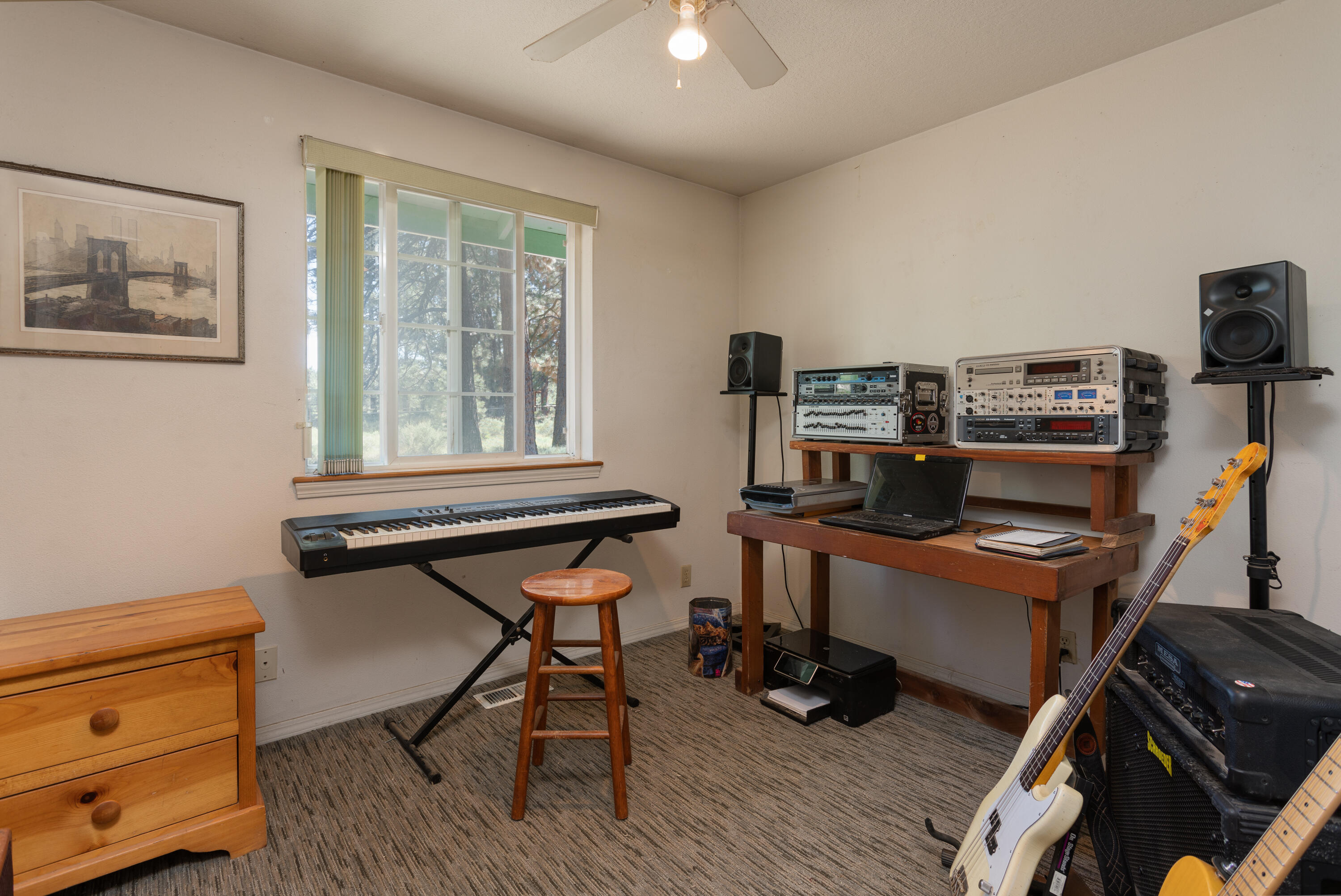 19335 Mohawk Road Bend, OR 97702 - Photo 14 of 24 a view of a workspace with furniture and a window