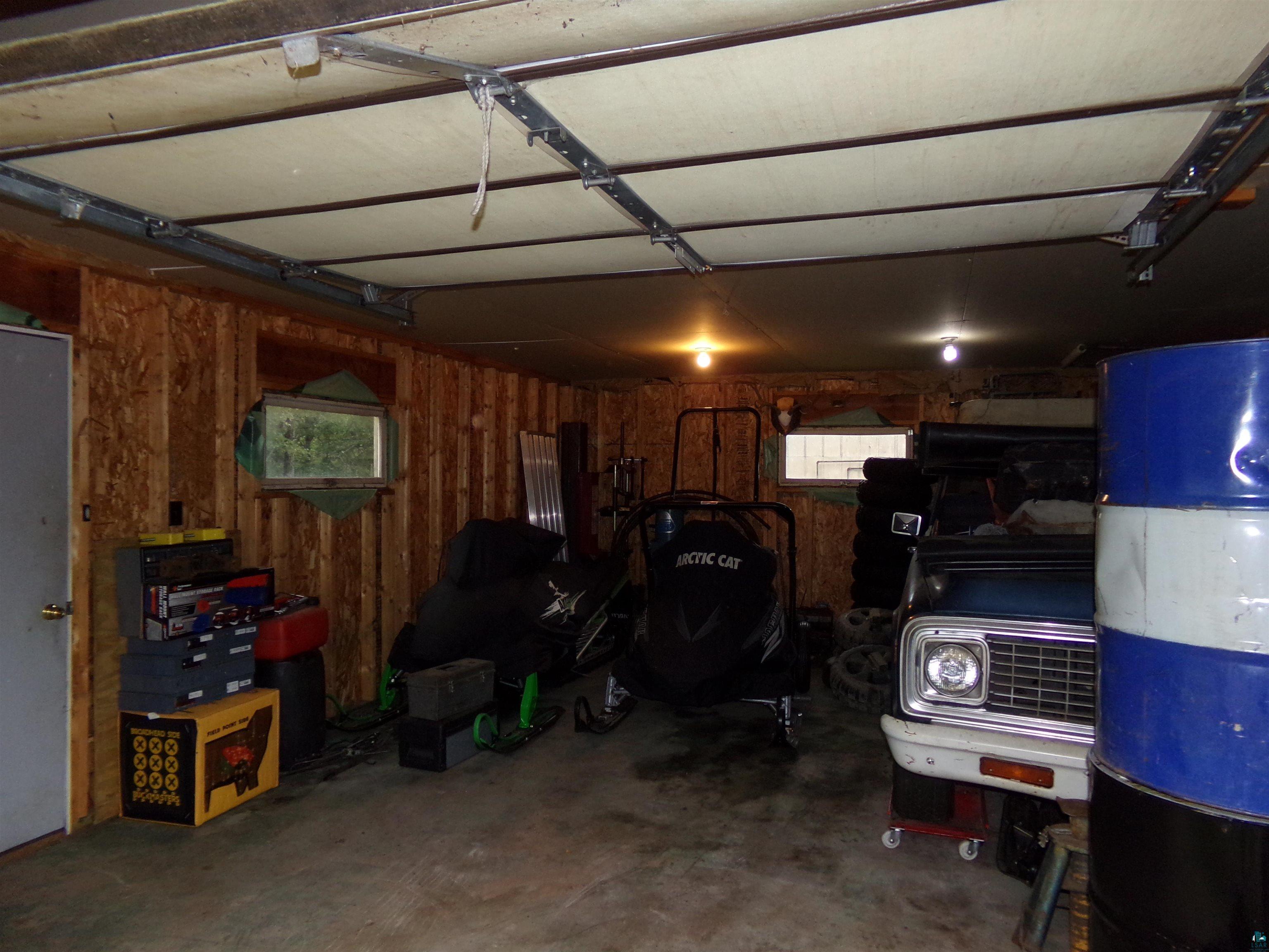 9039 Biller Loop Solon Springs, WI 54873 - Photo 17 of 17 Garage featuring wooden walls