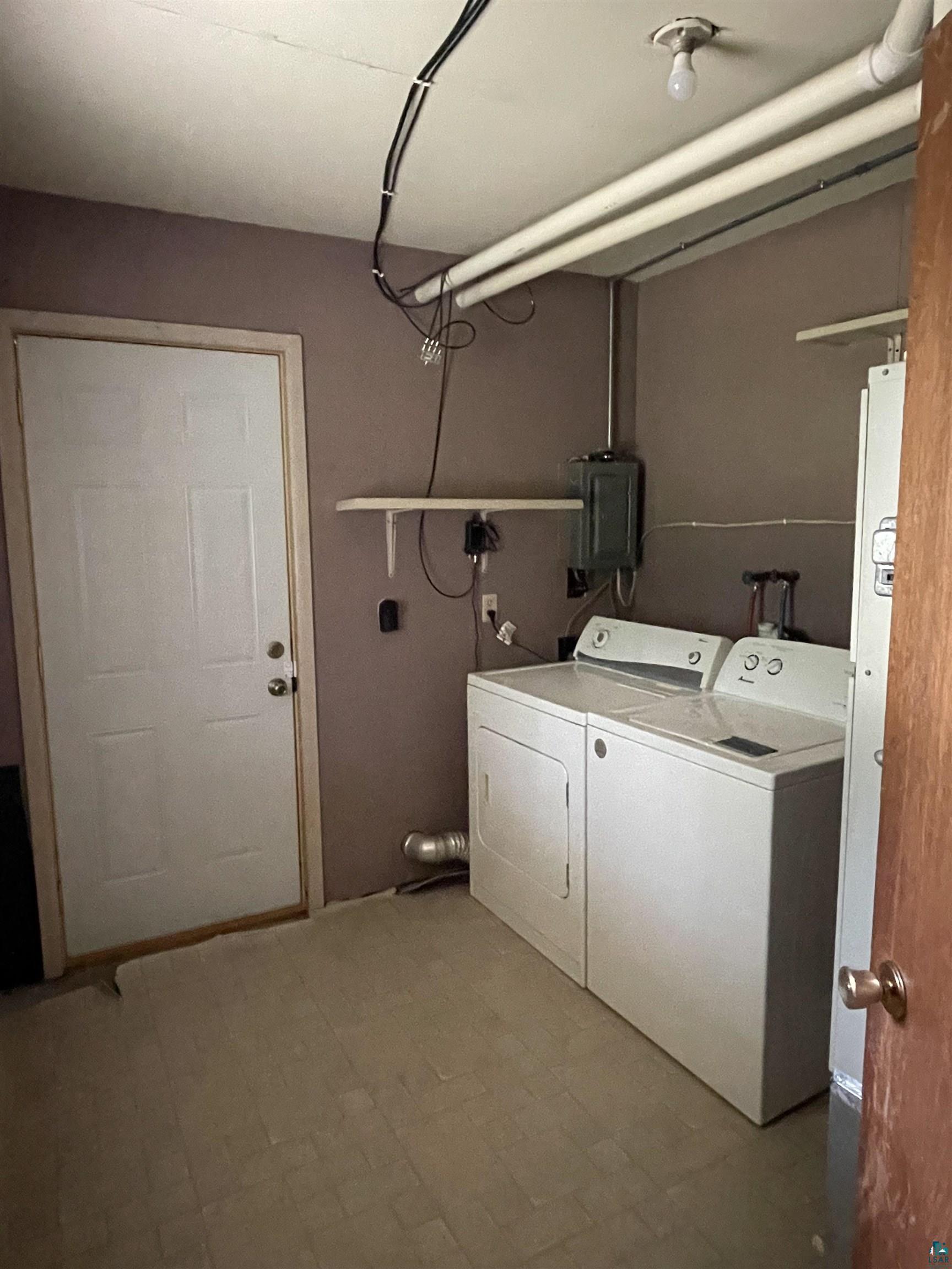 9039 Biller Loop Solon Springs, WI 54873 - Photo 10 of 17 Laundry room with tile flooring, washer hookup, and independent washer and dryer