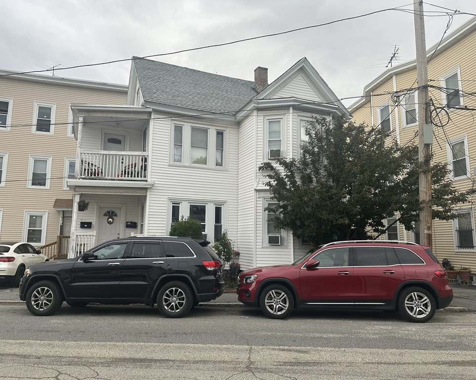 a car parked in front of a house