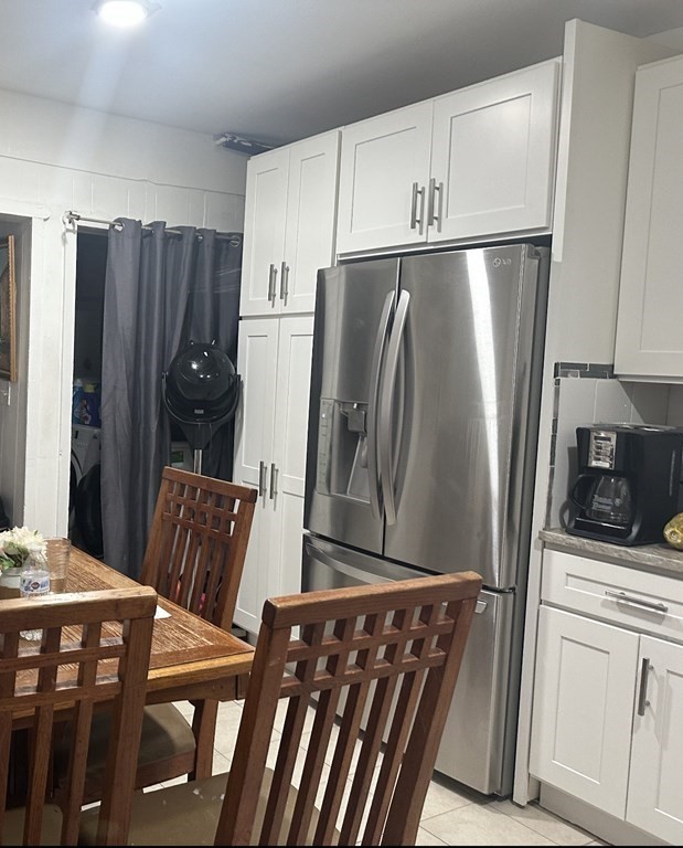113 Boston Street Methuen, MA 01844 - Photo 13 of 19 a kitchen with stainless steel appliances a refrigerator a stove a sink and white cabinets