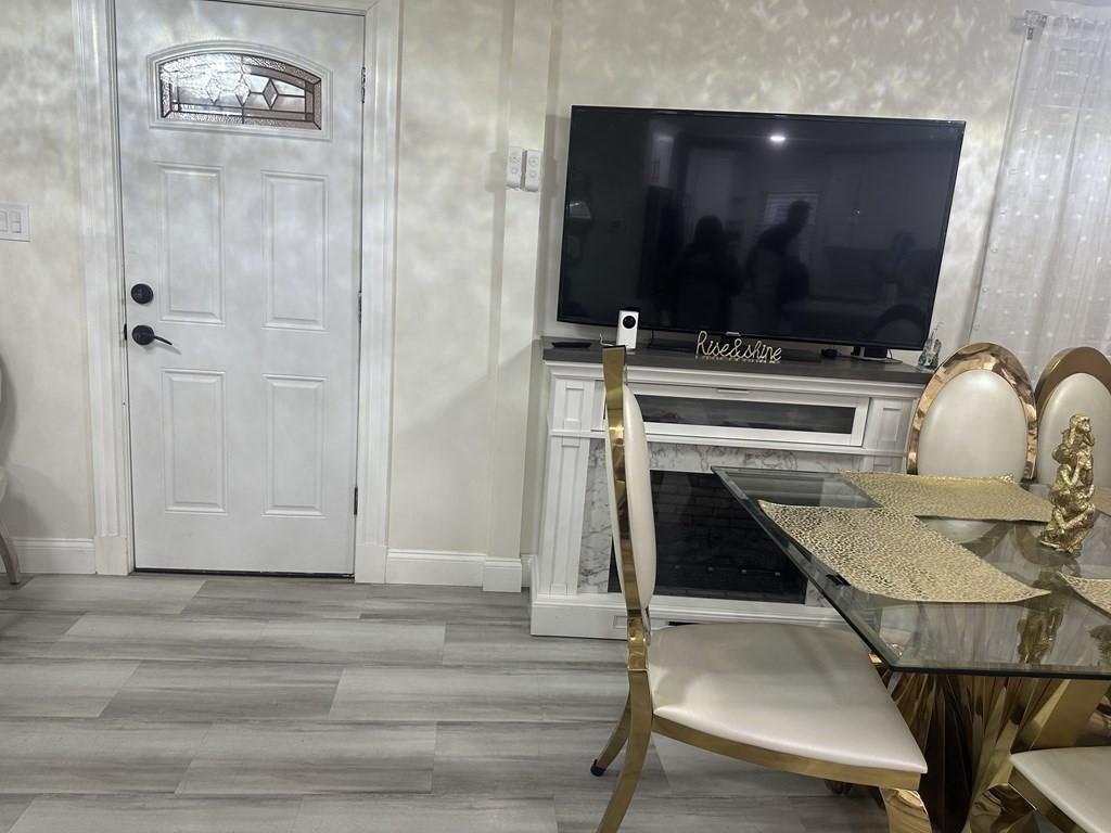 113 Boston Street Methuen, MA 01844 - Photo 3 of 19 a living room with a flat screen tv and furniture