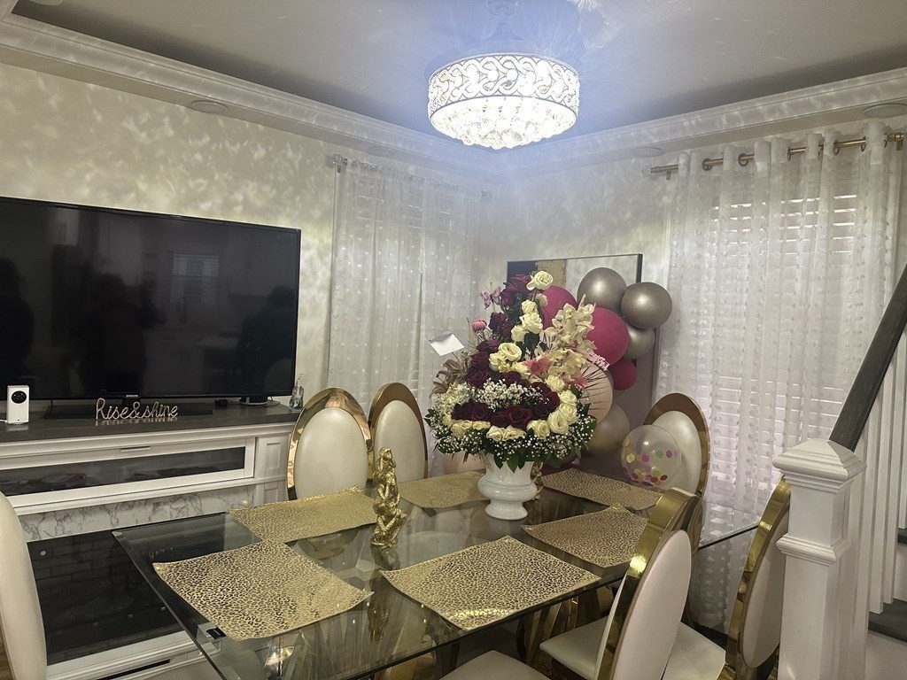 113 Boston Street Methuen, MA 01844 - Photo 4 of 19 a dining room with furniture and chandelier