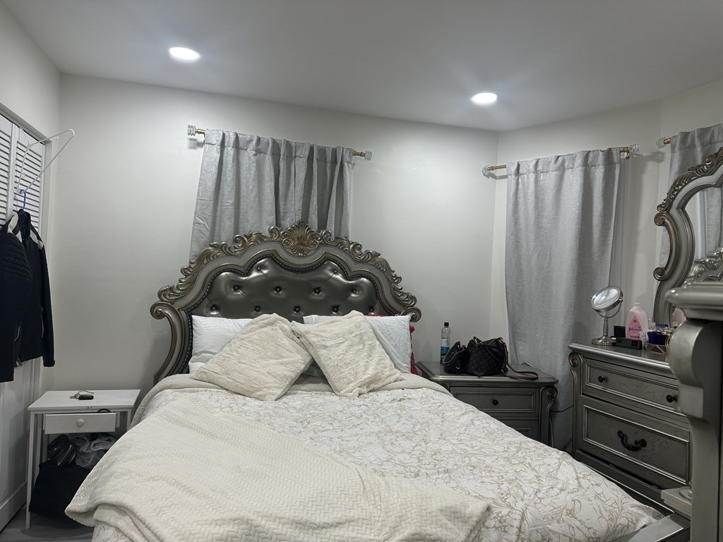 113 Boston Street Methuen, MA 01844 - Photo 7 of 19 a bedroom with a bed and a closet