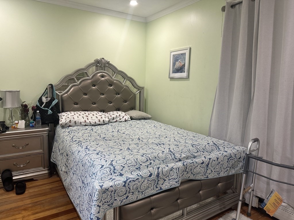 113 Boston Street Methuen, MA 01844 - Photo 8 of 19 a bedroom with a bed and dresser