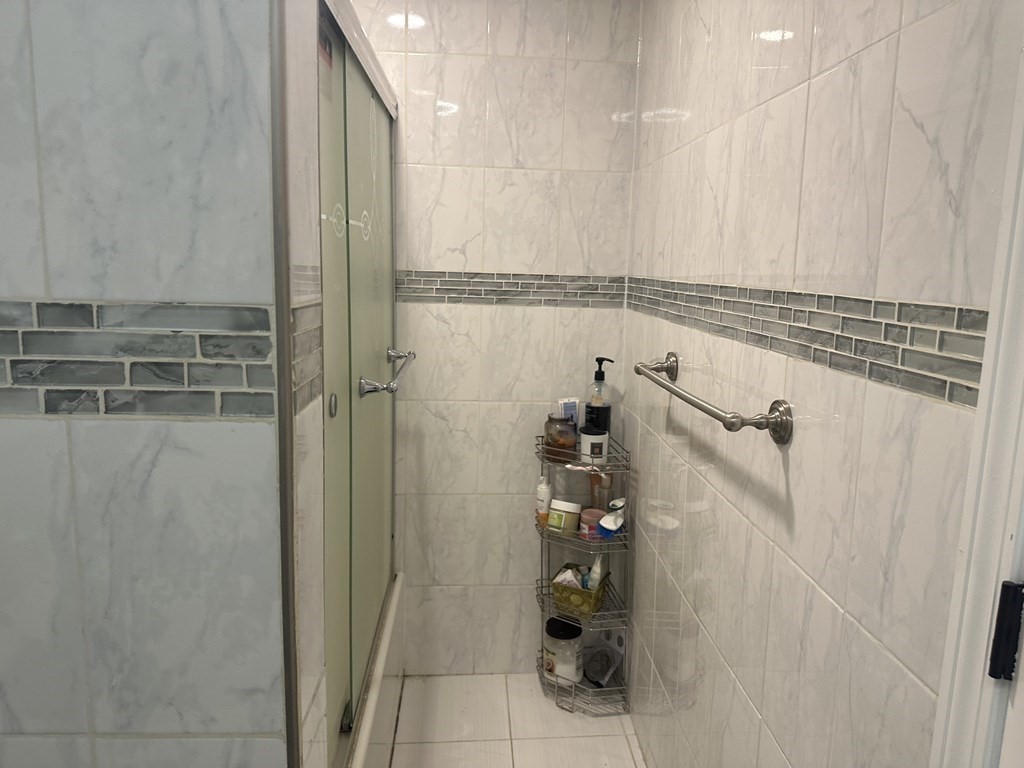 113 Boston Street Methuen, MA 01844 - Photo 10 of 19 a bathroom with a shower and a sink