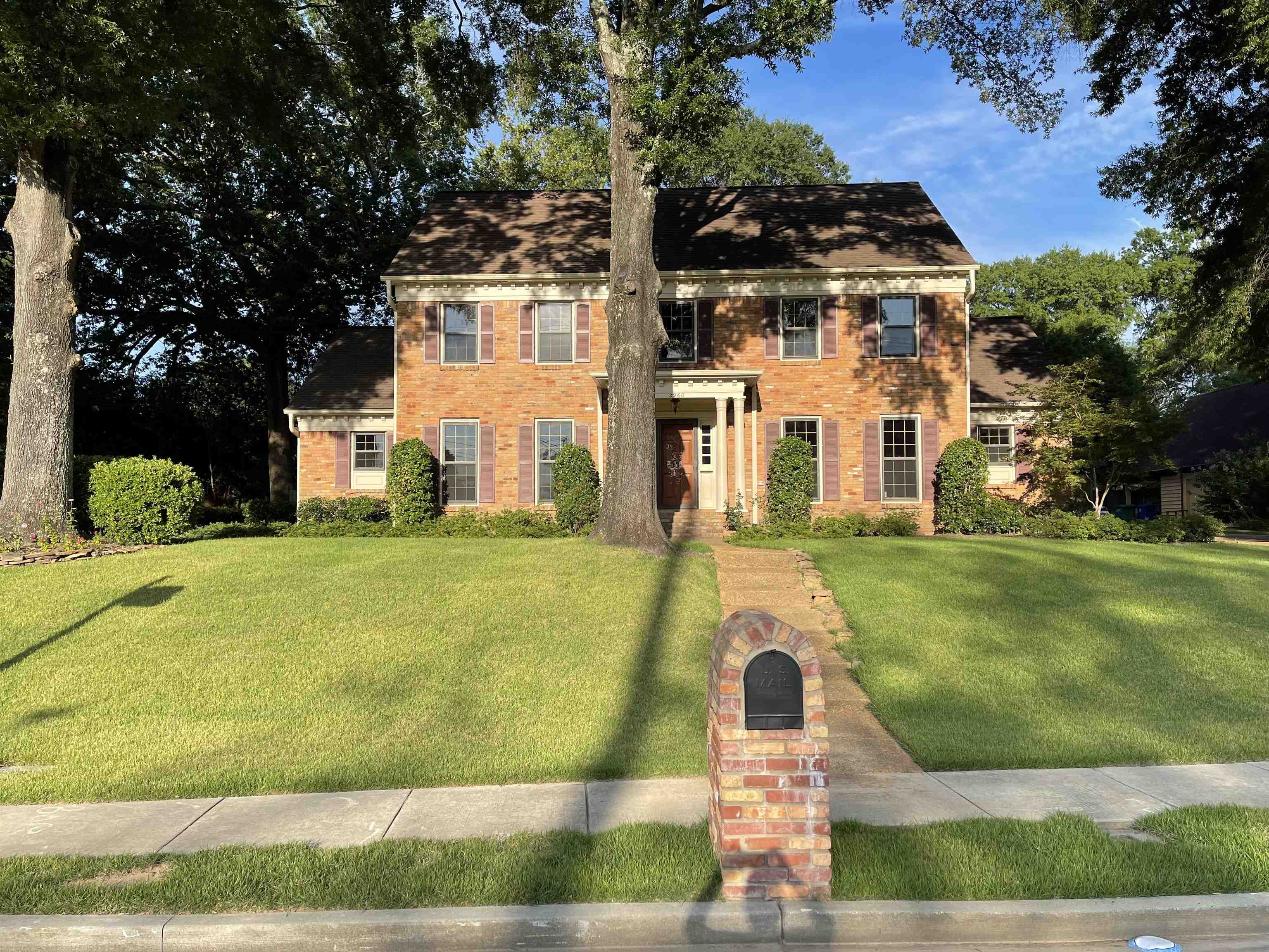 2960 South Germantown Road Germantown, TN 38138 - Photo 1 of 36 a front view of a house with a yard