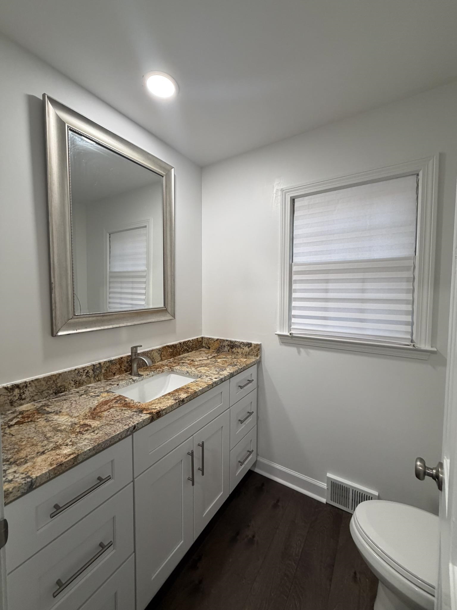 2960 South Germantown Road Germantown, TN 38138 - Photo 15 of 36 a bathroom with a granite countertop sink toilet and mirror