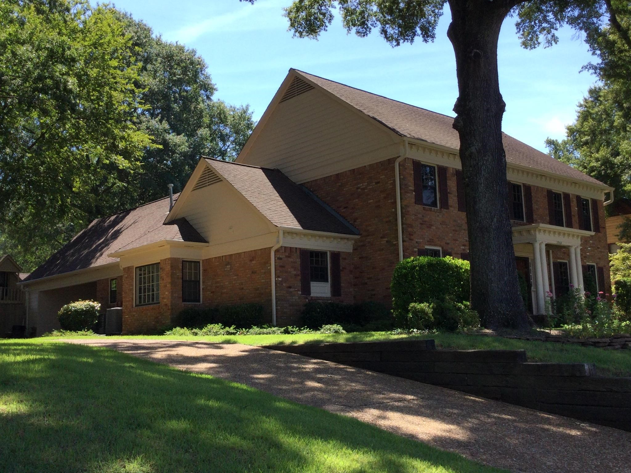 2960 South Germantown Road Germantown, TN 38138 - Photo 2 of 36 a front view of a house with a garden and plants