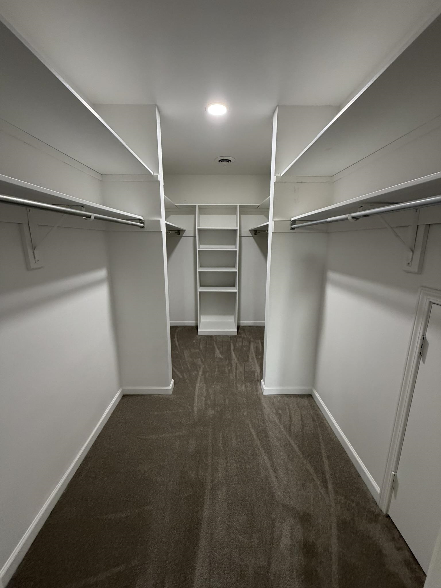 2960 South Germantown Road Germantown, TN 38138 - Photo 26 of 36 a view of walk in closet with empty racks