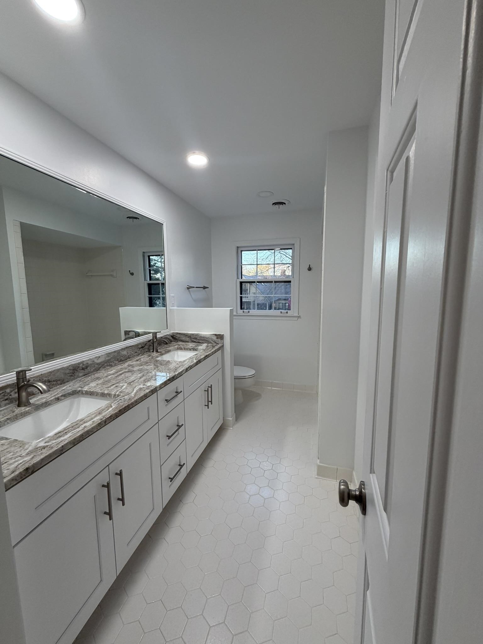 2960 South Germantown Road Germantown, TN 38138 - Photo 27 of 36 a spacious bathroom with a granite countertop sink a mirror and a