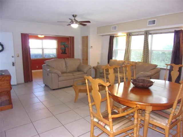a kitchen with stainless steel appliances a refrigerator sink and microwave