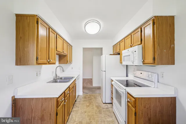 a bathroom with a double vanity sink mirror and bathtub