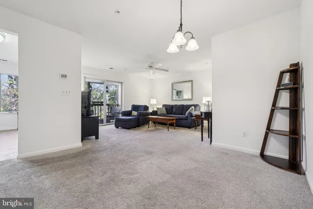 a view of a livingroom with furniture and a chandelier