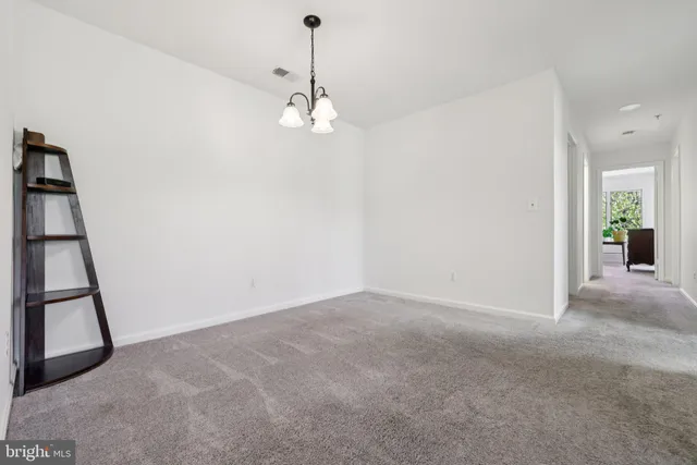 an empty room with a view of a bathroom