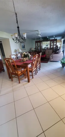 a bedroom with a bed and a ceiling fan