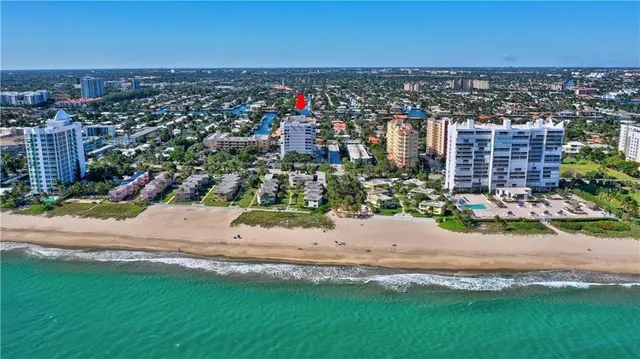 a view of a tall building next to a road