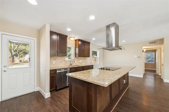 a kitchen with a stove and a sink