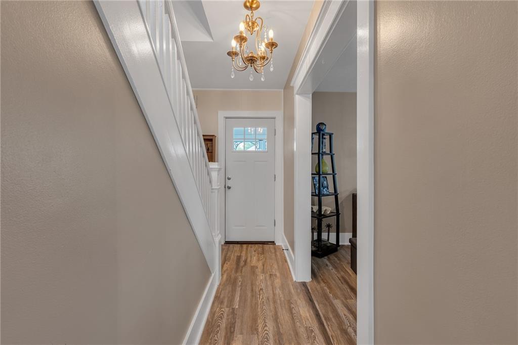 1160 6th Street Beaver, PA 15009 - Photo 12 of 31 a view of a hallway with wooden floor and entryway