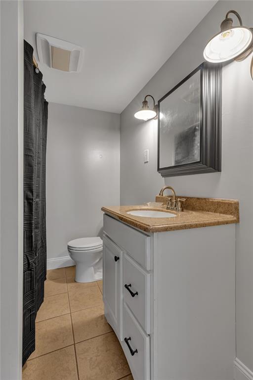 1160 6th Street Beaver, PA 15009 - Photo 21 of 31 a bathroom with a toilet sink and mirror